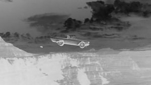 A still taken from the classic film Thelma and Louise shown in black and white negative.