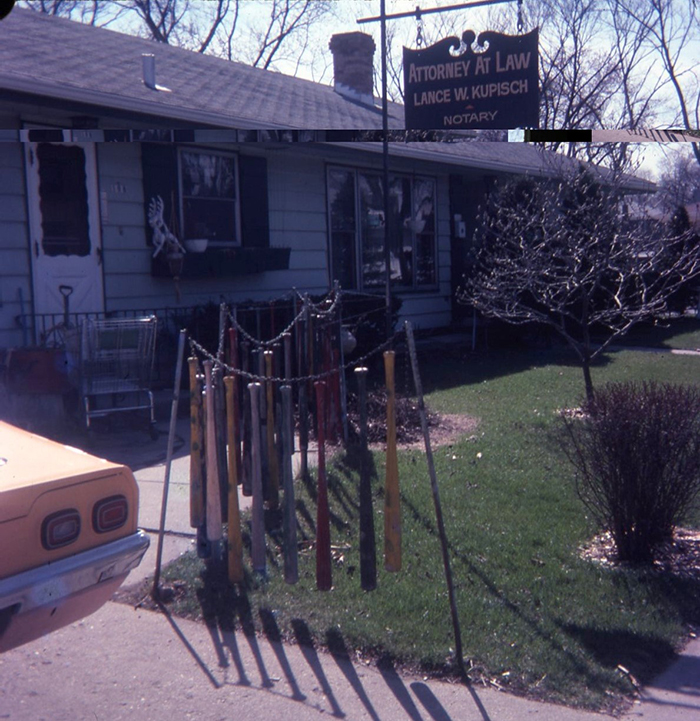 Greg Brown, photo of swinging baseball bat fence in attorney's front yard, c. 1976.