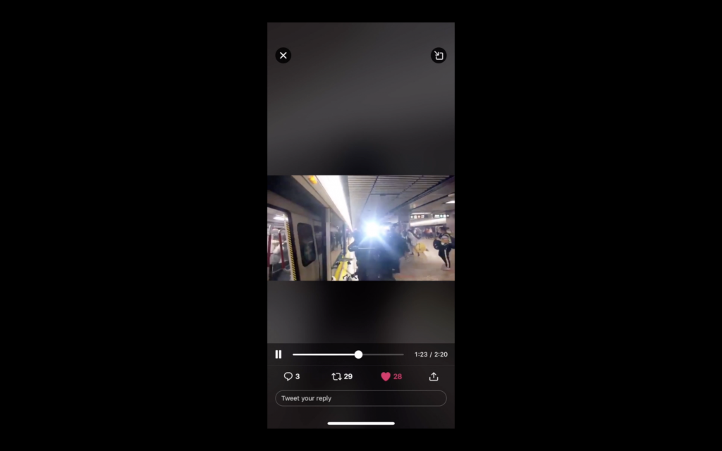 A screen shot of a tweet of a video of a camera flash on a subway station